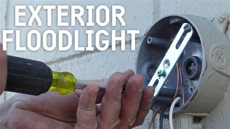 install junction box in place of flood light|install outdoor flood light fixture.